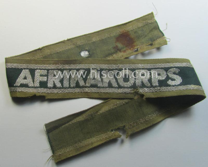 Relic, 'BeVo'-like cuff-title (ie. 'Ärmelstreifen') entitled: 'Afrikakorps' being a clearly issued and/or worn example that comes in an overall nice- (ie. hardly shortened- albeit somewhat damaged-), condition