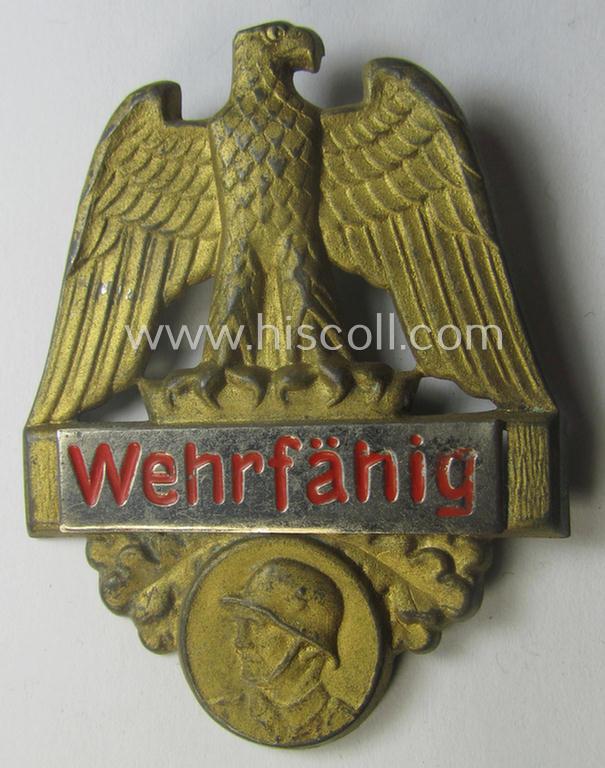 Commemorative, WHW- (ie. 'Winterhilfswerke'-) related 'tinnie' being a non-maker marked example depicting a 'Reichsadler' and showing a soldier wearing a steel-helmet and that is showing the text: 'Wehrfähig'