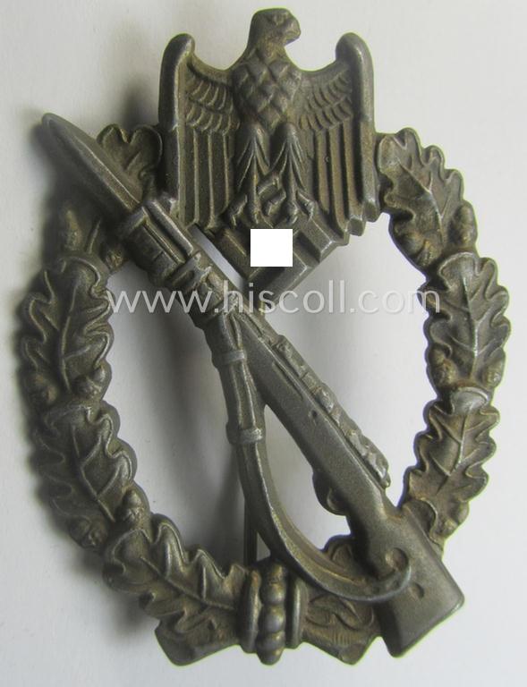 'Infanterie Sturmabzeichen in Bronze' (or: bronze-class infantry assault-badge ie. IAB) being a maker- (ie. 'ÜÜ'- ie. 'E.F. Wiedmann') marked so-called: 'Lily Pad-hinge'-example as was executed in zinc-based metal