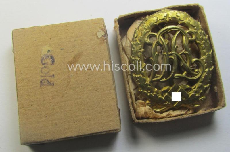 'Reichssportabzeichen DRL in Gold' (or: golden-class DRL sports'-badge) being a truly detailed and/or: maker- (ie. 'Wernstein - Jena'-) marked example that comes stored in its (rare!) period carton-based box