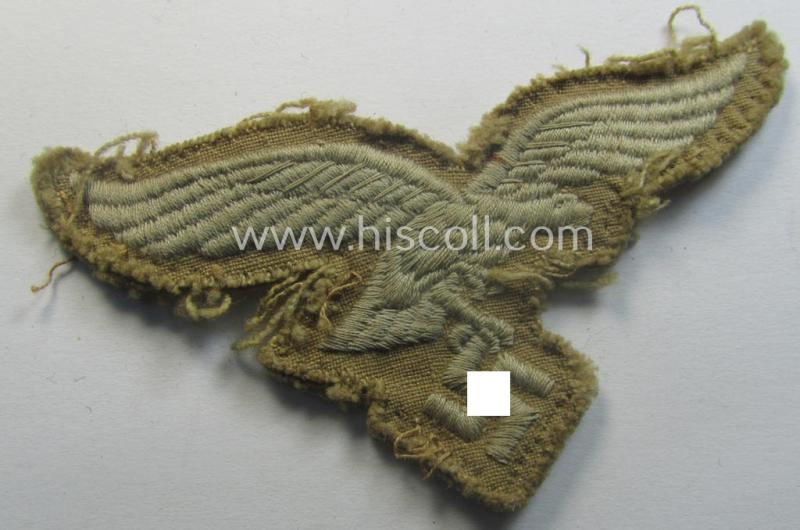 Clearly used - and actually very scarcely found! - WH (Luftwaffe) 'tropical'-issued- (ie. DAK or 'Deutsches Afrika Korps'-related) EM- ie. NCO-type breasteagle as was specifically intended for usage on the tropical-tunics