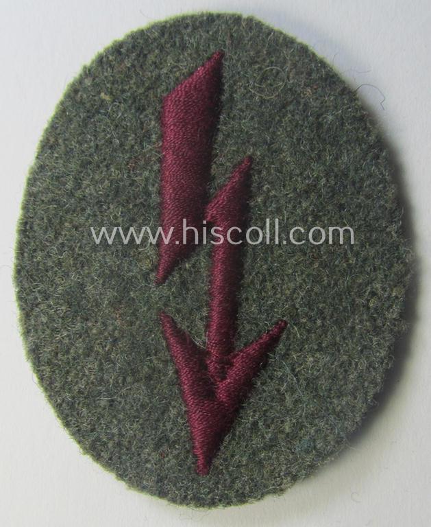 WH (Heeres) trade- and/or special-career-insignia (ie. machine-embroidered 'signal-blitz') example as executed in bordeaux-coloured linnen as was specifically intended for a soldier within the: '(Nebel)Werfer-Trpn.'