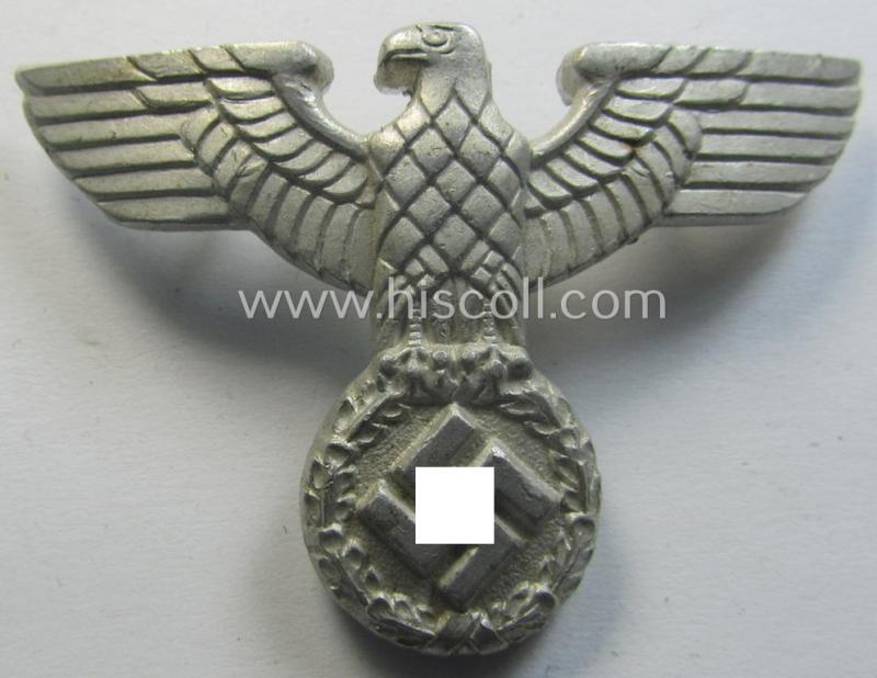 Smaller-sized, bright silverish-grey-coloured- and typical aluminium-based (political-style) visor- (ie. 'Schirmmützen'-) cap-eagle being a detailed example that is neatly: 'RzM - M1/17'-marked on its back