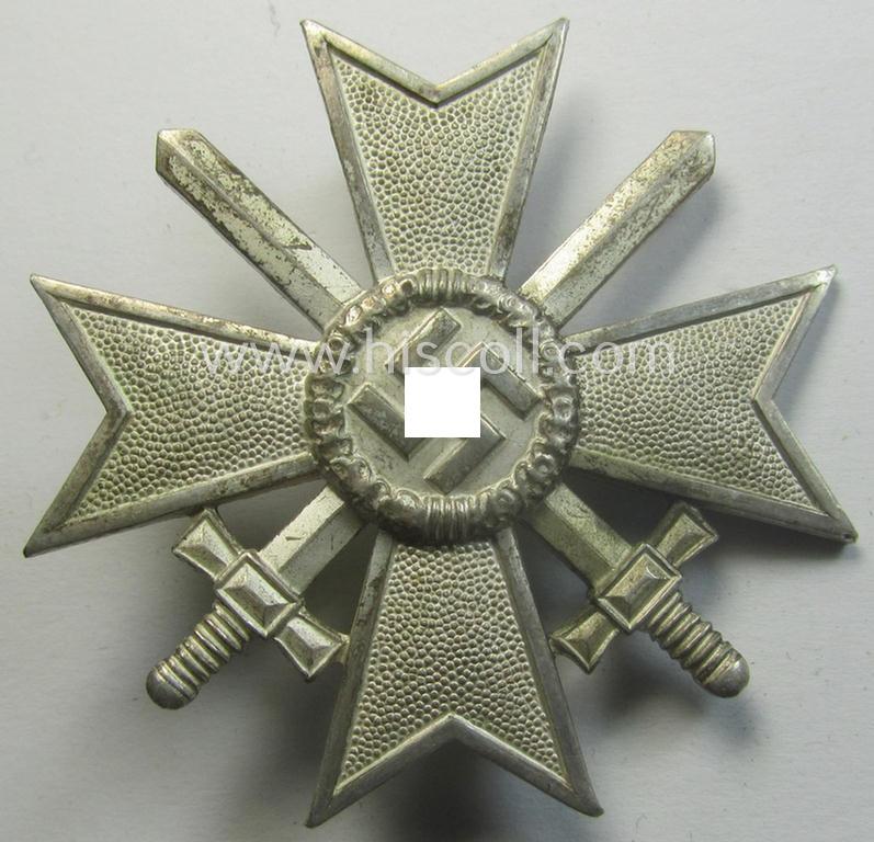 'Kriegsverdienstkreuz 1. Kl. mit Schwertern' being a maker- (ie. '84'-) marked and typical 'Buntmetall'-based specimen as was produced by the maker (ie. 'Hersteller'): 'Carl Poellath'