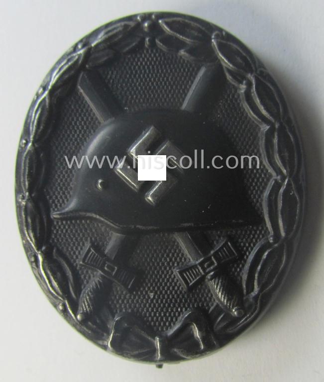 Maker- (ie. '63'-) marked example of a black-class wound-badge (or: 'Verwundeten-Abzeichen in Schwarz') being an example that was produced by the maker (ie. 'Hersteller') named: 'F.J. Klast & Söhne'