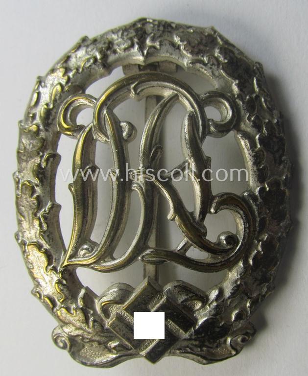 'Reichssportabzeichen DRL in Silber' (or: DRL sports'-badge in silver) being a just moderately worn- ie. used example that is nicely maker- (ie. 'Wernstein - Jena'-) marked on its back
