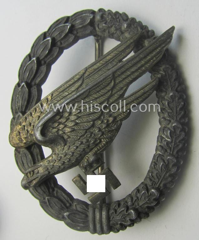 Zinc- (ie. 'Feinzink'-) based version of a WH (Luftwaffe) 'Fallschirmschützen-Abzeichen' (being a maker-marked, 'Type A'-pattern example as was produced by the 'G.H. Osang'-company)