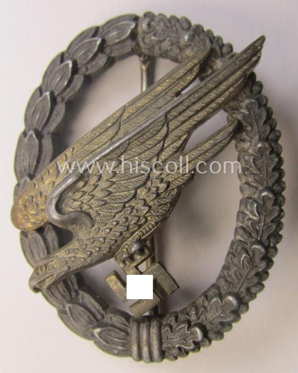 Zinc- (ie. 'Feinzink'-) based version of a WH (Luftwaffe) 'Fallschirmschützen-Abzeichen' (being a maker-marked, 'Type A'-pattern example as was produced by the 'G.H. Osang'-company)