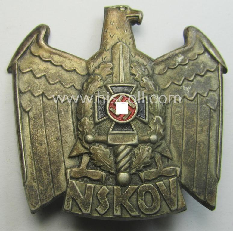 Metal-based cap-badge (ie. 'Mützenabzeichen') as was specifically intended for usage on a visor-cap of the: 'Nationalsozialistischer Kriegsopfer-Versorgung' (ie.: 'N.S.K.O.V.')