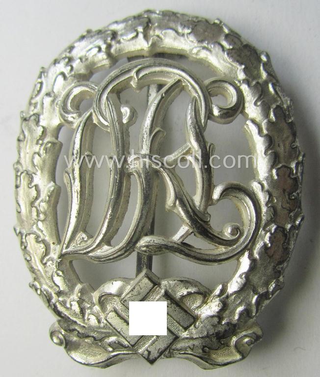'Virtually mint' example of a: 'Reichssportabzeichen DRL in Silber' (or: DRL sports'-badge in silver) being a just moderately worn- ie. used example that is nicely maker- (ie. 'Wernstein - Jena'-) marked on its back