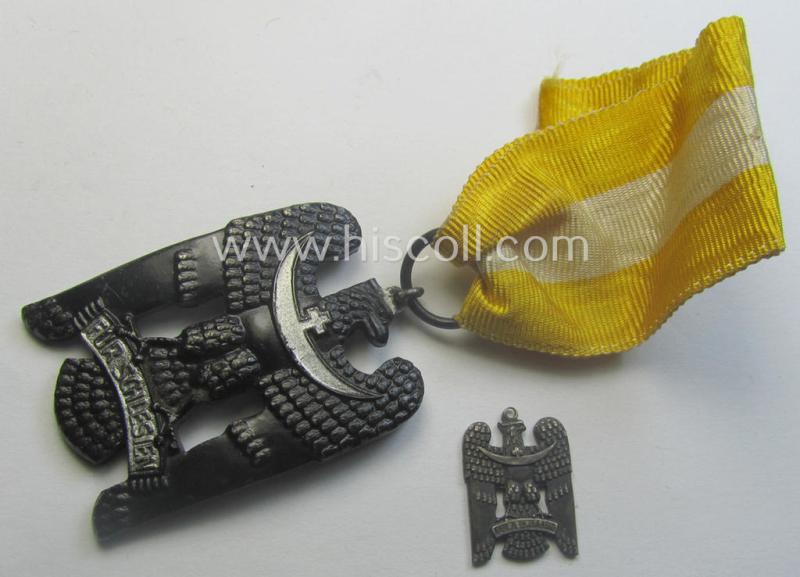 'Schlesisches Bewährungsabzeichen der II. Kl.' (or: 'Schlesischer Adler 2. Stufe') being a just moderately used example that comes mounted onto its full-length ribbon (ie. 'Bandabschnitt') and accompayning miniature as found