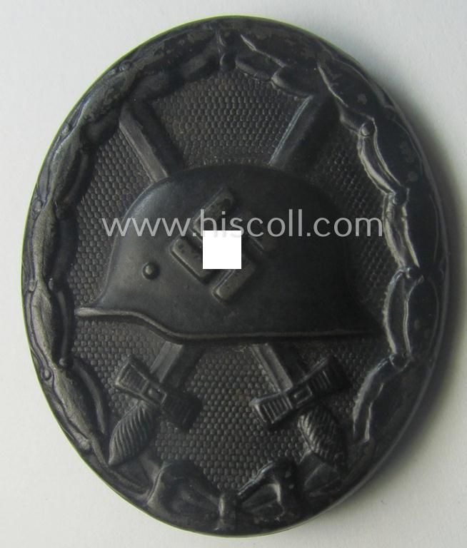 Dual-maker- (ie. 'E.H.'- and/or: '126'-) marked example of a black-class wound-badge (or: 'Verwundeten-Abzeichen in Schwarz') being an example that was produced by the maker (ie. 'Hersteller') named: 'Eduard Hahn'