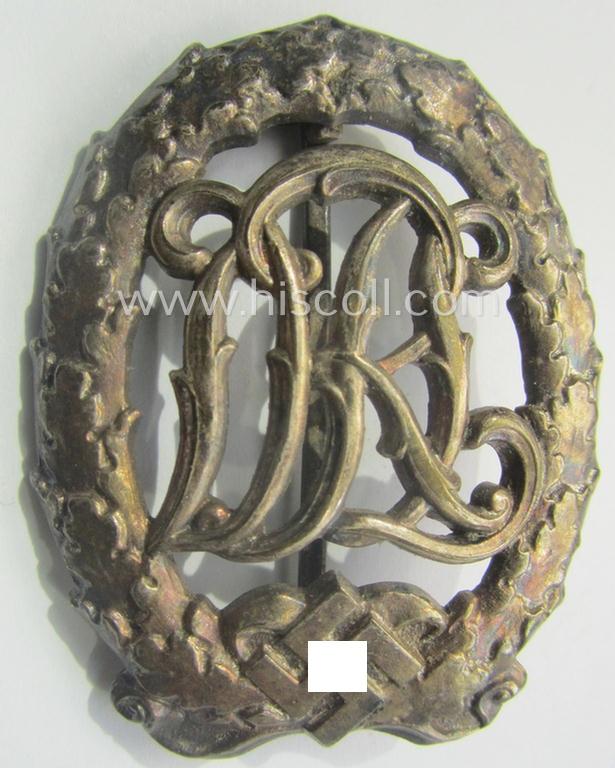 'Reichssportabzeichen DRL in Silber' (or: DRL sports'-badge in silver) being a just moderately worn- ie. used example that is nicely maker- (ie. 'Wernstein - Jena'-) marked on its back