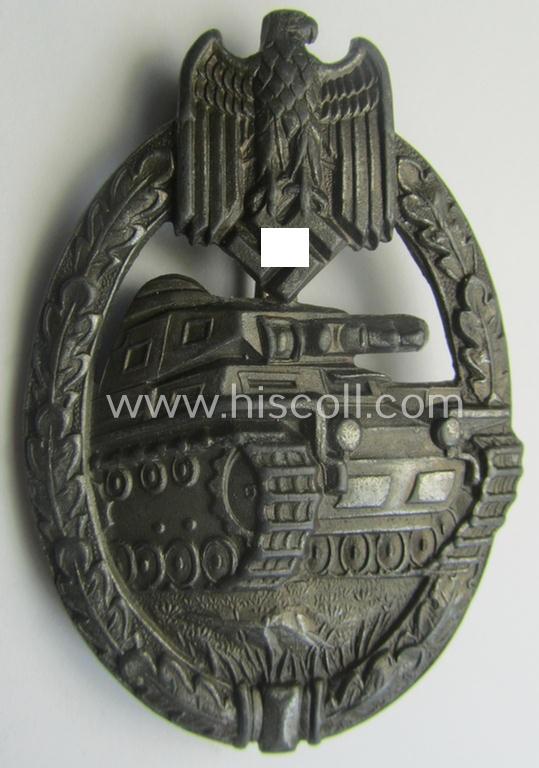 'Panzerkampf-Abzeichen in Bronze' being a 'hollow-back', non-maker-marked- (and/or: zinc- ie. 'Feinzink'-) based example as was procuced by the: 'C.E. Juncker'-company