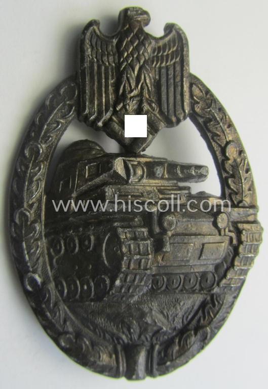 'Panzerkampfabzeichen in Silber' (or: silver-class panzer-assault badge or PAB) being a (typical) non-maker-marked- and/or hollow zinc- (ie. 'Feinzink'-) based example as was produced by the: 'Wilh. Deumer'-company