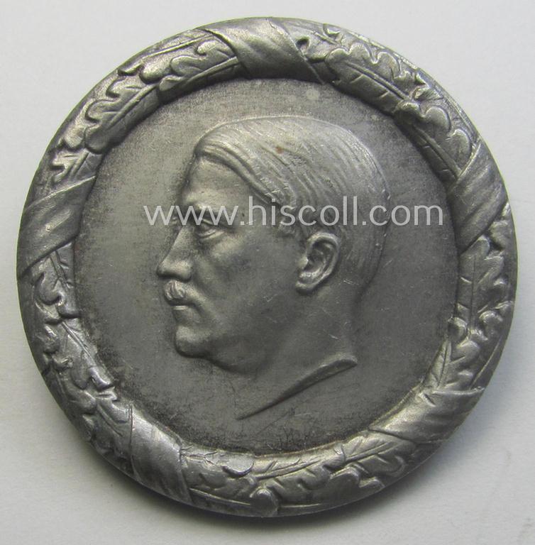 Commemorative, WHW- (ie. 'Winterhilfswerke'-) related 'tinnie' or day-badge being a maker- (ie. 'LN'-) marked example depicting detailed illlustration of 'Adolf Hitler'