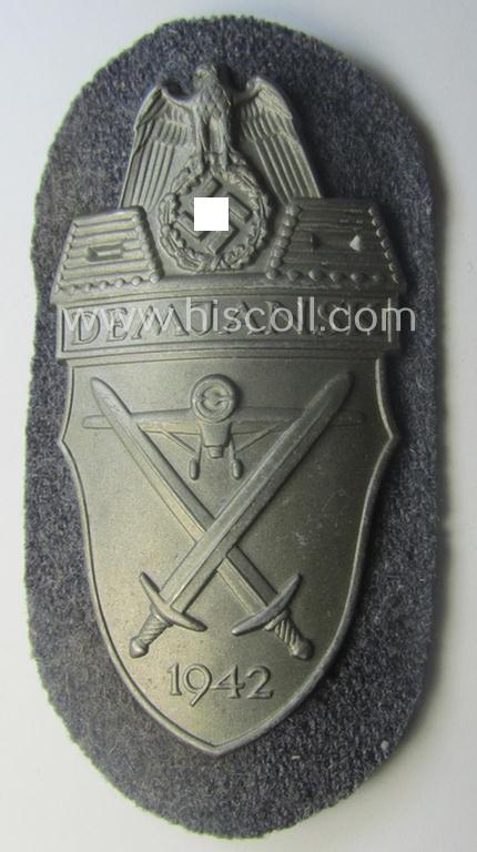 WH (Luftwaffe) 'Demjansk'-campaign-shield as executed in typical magnetic metal (ie. so-called: 'Eisenblech') and that comes in an overall very nice- (ie. still 'virtually mint' ie. fully untouched!), condition