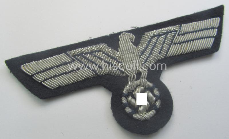 WH (Kriegsmarine) neatly hand-embroidered, officers'-type breasteagle on a darker-blue background as was specifically intended for the various naval administrative-officials (ie. 'Beambten der Kriegsmarine')