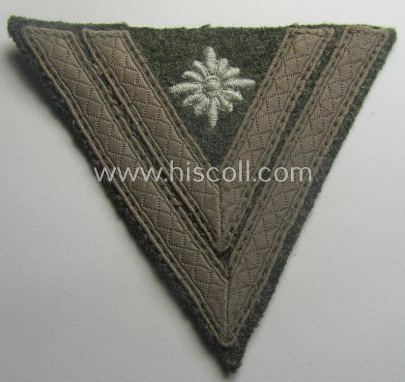 WH (Heeres) 'Armwinkel' (or: arm-chevron) as executed on typical field-grey-coloured wool as was specifically intended for usage by a soldier with the (unusually encountered!) rank of: 'Stabsgefreiter'