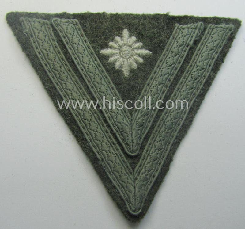 WH (Heeres) 'Armwinkel' (or: arm-chevron) as executed on typical field-grey-coloured wool as was specifically intended for usage by a soldier with the (unusually encountered!) rank of: 'Stabsgefreiter'
