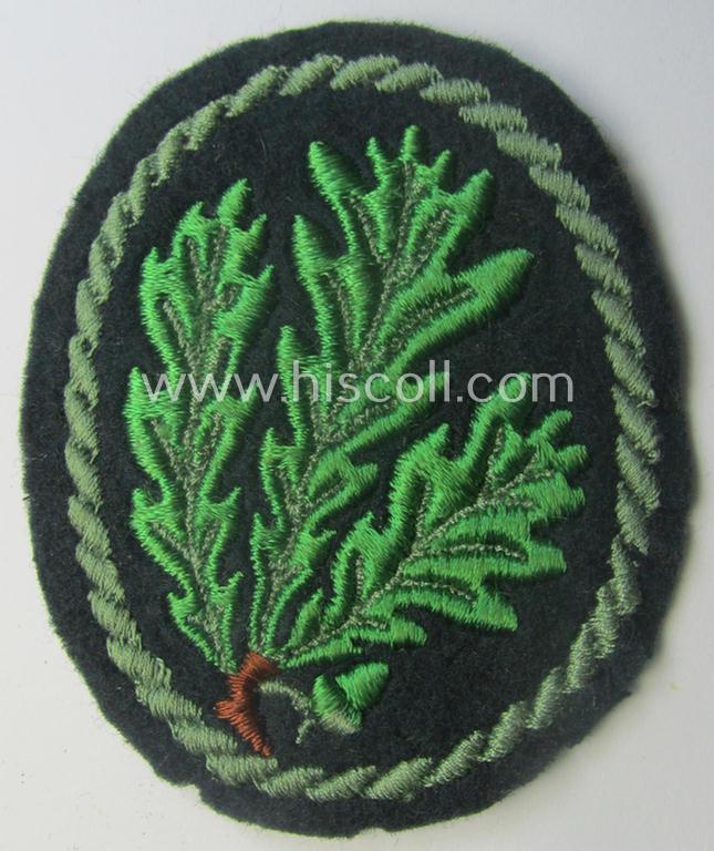 WH (Heeres) so-called: 'Jäger'-armbadge being a neatly machine-embroidered- and/or multi-coloured version as was executed on darker-green-coloured wool