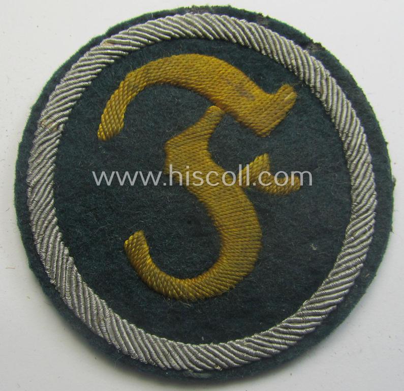 Truly used- and/or worn, WH (Heeres) machine-embroidered, trade- and/or special-career insignia (ie. 'Tätigkeitsabzeichen') as executed on a darker-green-coloured background as was intended for a: 'geprüfter Feuerwerker'