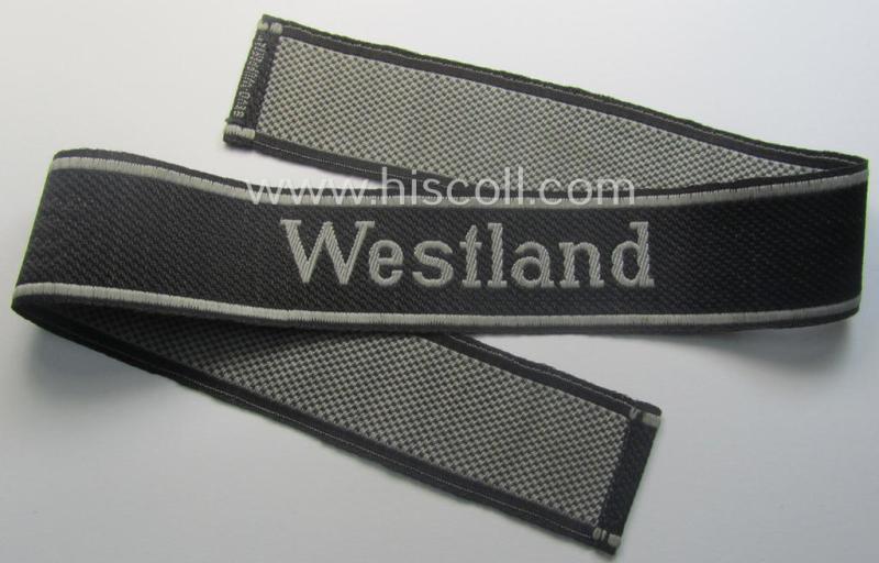 Waffen-SS, 1943/44 pattern cuff-title (ie. 'Ärmelstreifen') depicting the machine-woven Latin script text in silver-grey linnen as was intended for a member of the: 'SS-Regiment': 