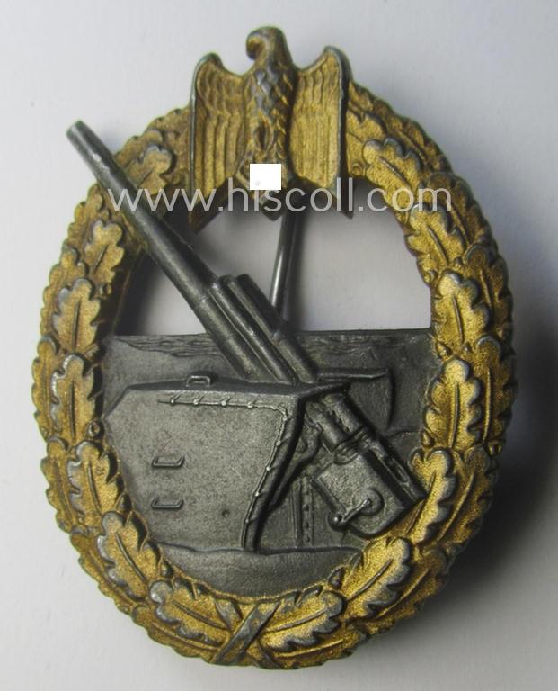 WH (KM) 'Marine-Artillerie-Abzeichen' being a maker- (ie. 'F.L.L. - 43'-) marked- and/or zinc- (ie. 'Feinzink'-) based example by the: 'Friedrich Linden'-company