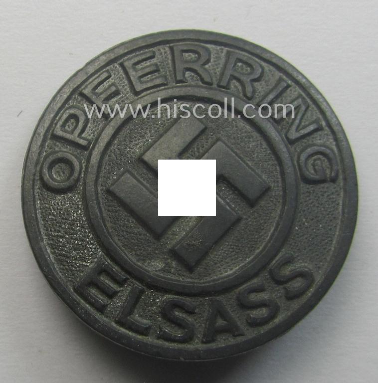 Zinc- (ie. 'Feinzink'-) 'N.S.D.A.P.'-related supporter-pin- (or: 'Symphatisanten-Abzeichen') being a maker- (ie. 'R. Hauschild'-) marked example showing the text: 'Opferring Elsass'
