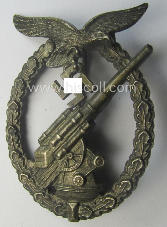 WH (Luftwaffe) 'Flakkampfabzeichen' being a detailed 'Buntmetall'-based and (unusually seen!) non-maker-marked example as was produced by the: 'C.E. Juncker'-company and that comes as moderately worn