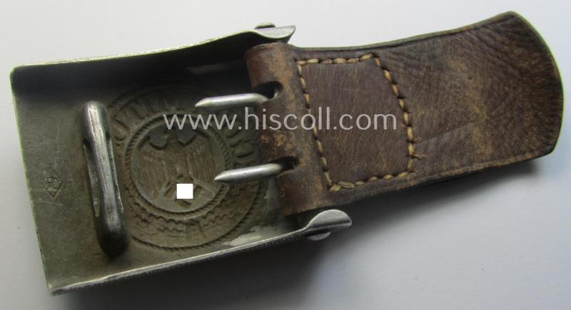 WH (Heeres) 'standard-pattern', field-grey-toned- and aluminium-based belt-buckle being a maker- (ie. 'Paulmann & Crone'-) marked- and/or: '1938'-dated example that comes mounted onto its leather-based tab