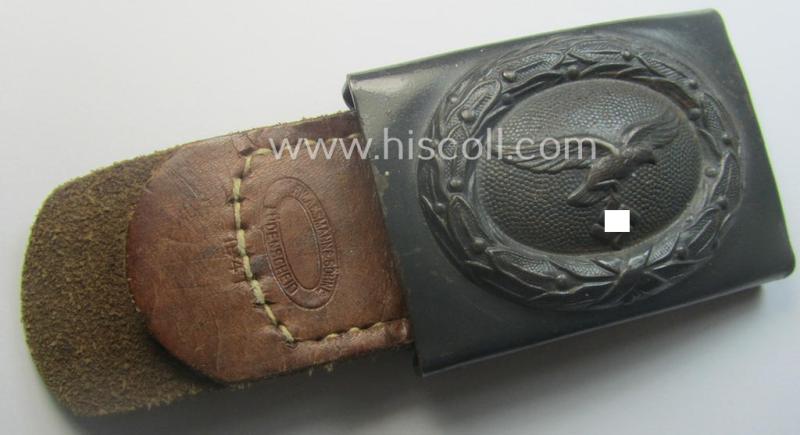 WH (Luftwaffe) blue-coloured- and/or steel-based belt-buckle, being a neatly maker- (ie. 'F.W. Assmann'-) marked and/or: '1941'-dated example that comes mounted onto its period, natural-coloured and/or leather-based tab