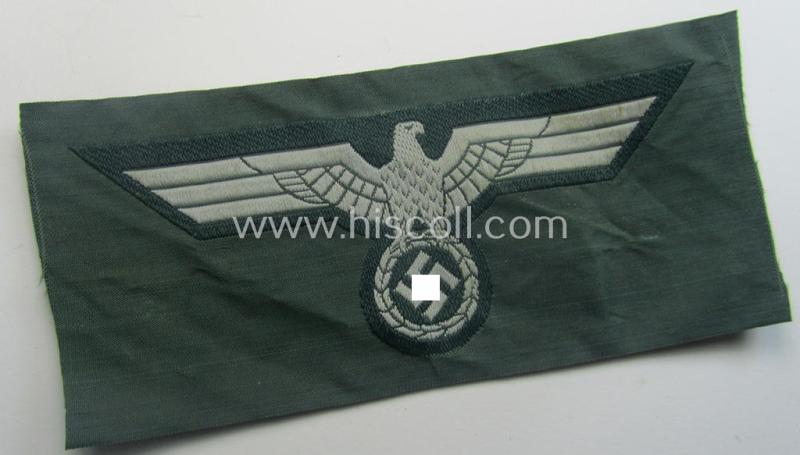 WH (Heeres) early- (ie. pre-war-) period- and/or greyish-coloured breast-eagle of the: 'M36'- (ie. 'M40'-) pattern as was executed in the 'BeVo'-weave pattern on a darker-green-coloured background