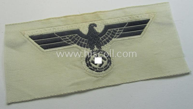 WH (KM) EM- (ie. NCO-) type side-cap-eagle (ie. 'Schiffchenadler für Mannschaften u. Uffz. der KM') as executed in the 'BeVo'-weave-pattern on a white-coloured background as was specifically intended for usage on the various white-coloured side-caps