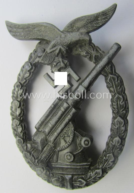 Later-war period- and/or: zinc- (ie. 'Feinzink'-) based- example of a maker- (ie. 'WH'-) marked, WH (Luftwaffe) 'Flakkampfabzeichen' (or: airforce anti-aircraft badge), as was produced by the desirable: 'Wilhelm Hobacher'-company