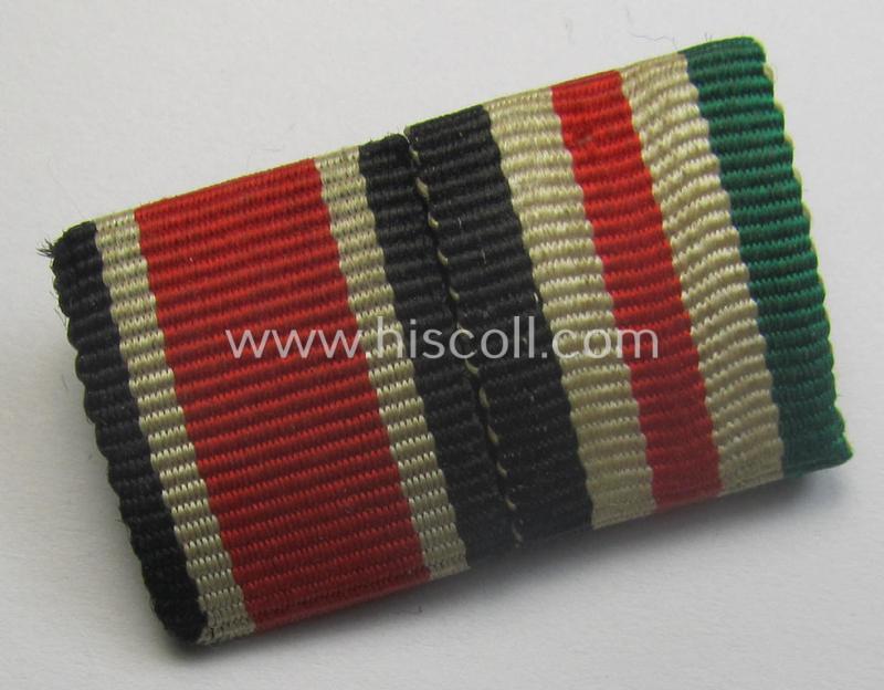 Two-pieced ribbon-bar (ie. 'Band- o. Feldspange') showing resp. the ribbons for an: 'EKII. Klasse' and a: 'Deutsch-Italienische Feldzugsmedaille'