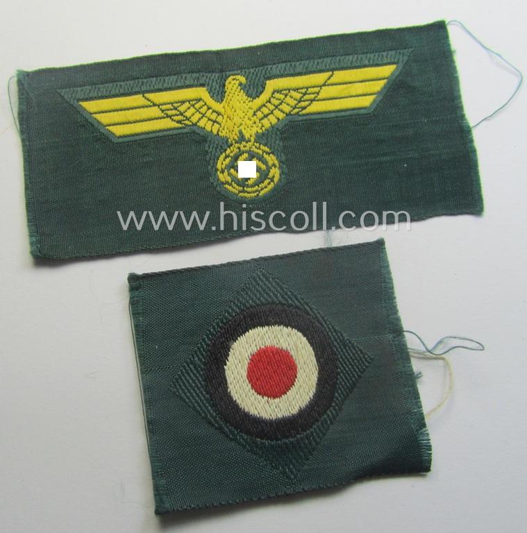 WH (KM ie. 'Küsten-Marine o. Marine-Art.') side-cap-eagle and cocarde-set (being a 'virtually mint- ie. unissued' set as executed in golden-yellow-coloured linnen on a darker-green-coloured background)