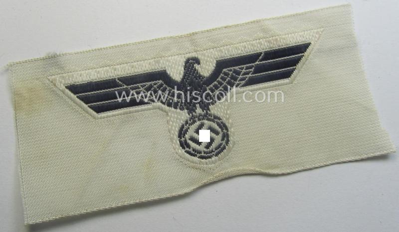 WH (KM) EM- (ie. NCO-) type side-cap-eagle (ie. 'Schiffchenadler für Mannschaften u. Uffz. der KM') as executed in the 'BeVo'-weave-pattern on a white-coloured background as was specifically intended for usage on the various white-coloured side-caps