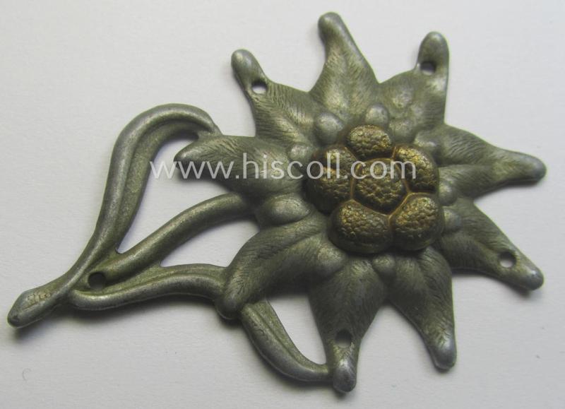 WH (Heeres) (bright) silverish-coloured, zinc-based (albeit non-maker-marked): 'M43'-pattern 'Edelweiss'-cap-badge (ie. 'Mützenabzeichen')