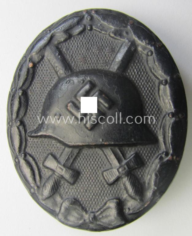 Neatly maker- (ie. '118'-) marked example of a black-class wound-badge (or: 'Verwundeten-Abzeichen in Schwarz') being an example that was produced by the (Austrian-based) maker (ie. 'Hersteller') named: 'August Menze & Sohn'