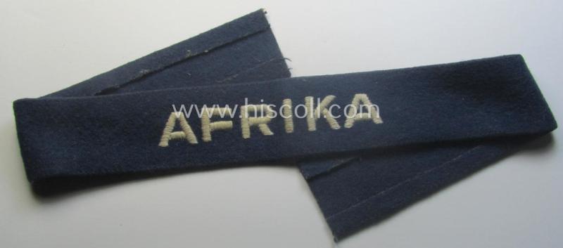 Darker-blue toned, WH (Luftwaffe) cuff-title (ie. 'Ärmelstreifen') entitled: 'Afrika' (being a full-length example that comes in an issued-, used and/or carefully tunic-removed, condition)