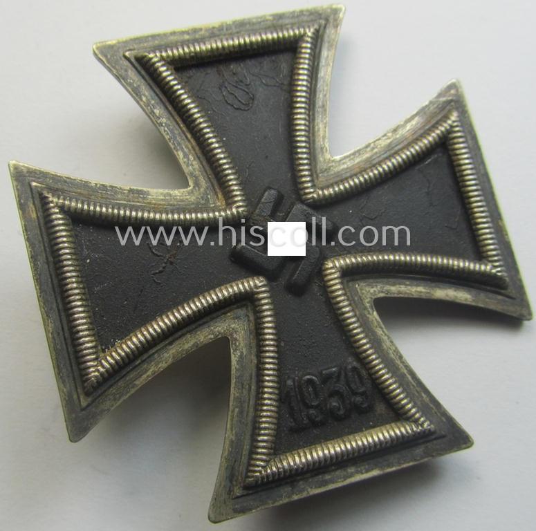 Fully untouched, 'Eisernes Kreuz 1. Kl.' (or: Iron Cross 1st class) being a typical, maker- (ie. '6.'-) marked example by the maker (ie. 'Hersteller'): 'Fritz Zimmermann' and that comes as issued and worn