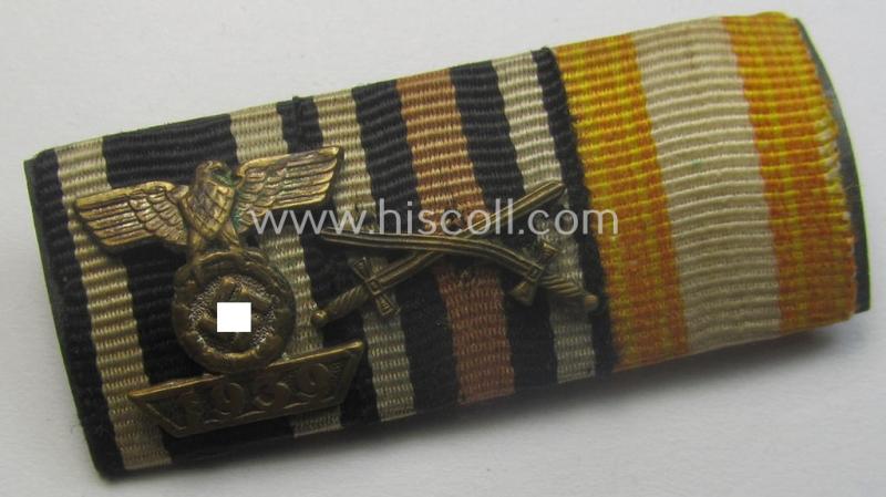 3-pieced medal-bar (or: 'Feld-/Bandspange') depicting the ribbons for a WWI-period: 'EKII. Kl.' (having a: 'Wiederhohlungs-Spange'-miniature attached!), a 'FKK 1914-18 m. S.' and a: 'Erinnerungsmedaille für Rettung aus Gefahr'