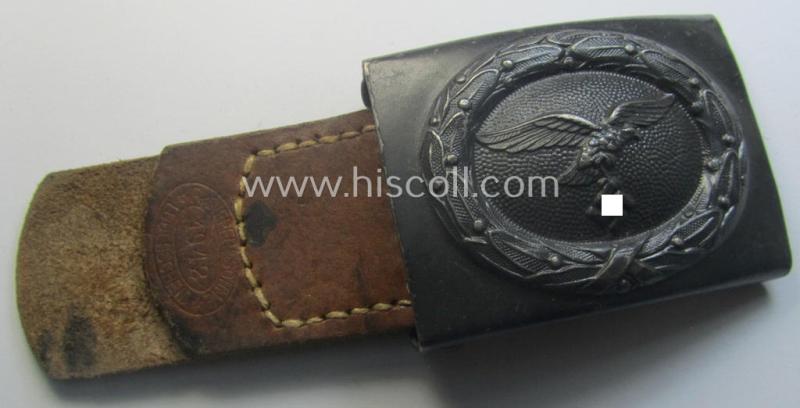 WH (Luftwaffe) darker-blue-coloured- and/or steel-based belt-buckle, being a neatly maker- (ie. 'R. Sieper & Söhne'-) marked and/or: '1942'-dated example that comes mounted onto its period, natural-coloured and/or leather-based tab