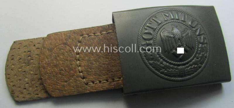 WH (Heeres) 'standard-pattern', field-grey-toned- and steel-based belt-buckle being a maker- (ie. 'H. Arld - Nuernberg'-) marked- and/or: '1942'-dated example that comes mounted onto its leather- (ie. 'pig-skin'-) based tab
