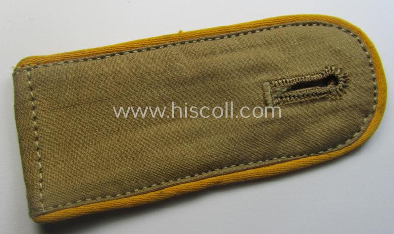 Single, WH (Luftwaffe) tropical-issued, EM-type-shoulderstrap as executed in beige-coloured linnen (as was specifically intended for usage on the tropical-shirts ie. tunics) as was intended for a: 'Soldat der Flieger- o. Fallschirmjäger-Trpn.'