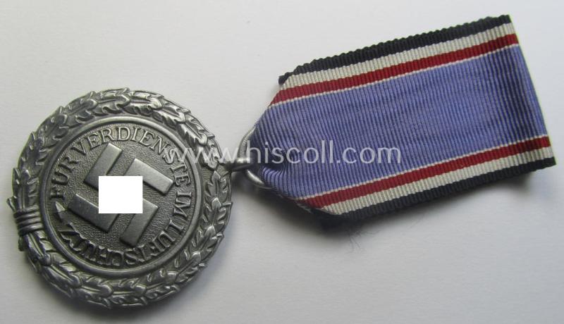 'Luftschutz-Ehrenzeichen 2. Stufe' being a maker- (ie. '10'-) marked example, as executed in (heavy) zinc-based metal (ie. 'Feinzink') and that came together with its period ribbon (ie. 'Bandabschnitt')