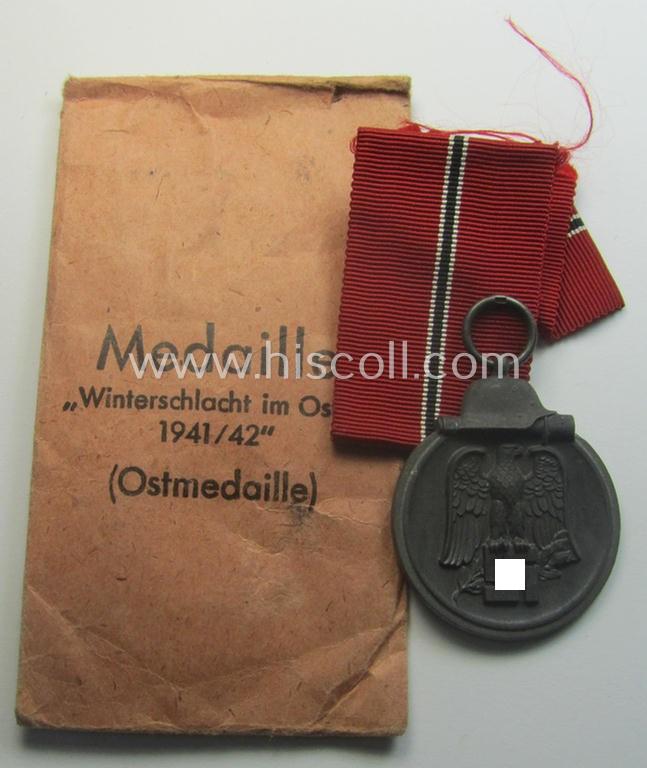 Neatly maker- (ie. '15'-) marked medal: 'Winterschlacht im Osten 1941/42' that came stored in its period pouch by the (Austrian-based) company: 'Friedrich Orth'