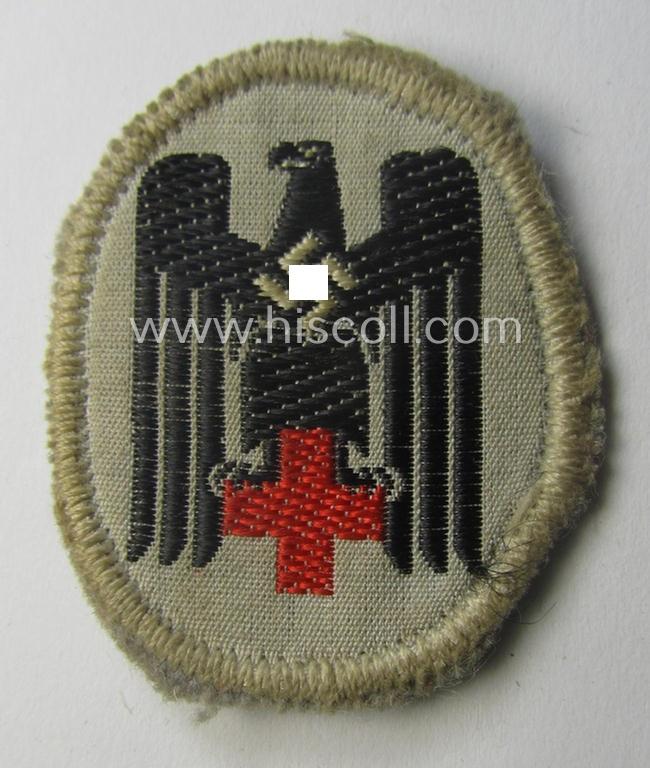 German Red Cross ('DRK' or: 'Deutsches Rotes Kreuz') side-cap eagle to be worn on the specic, greyish-blue-coloured DRK side-caps (ie. 'Schiffchen')