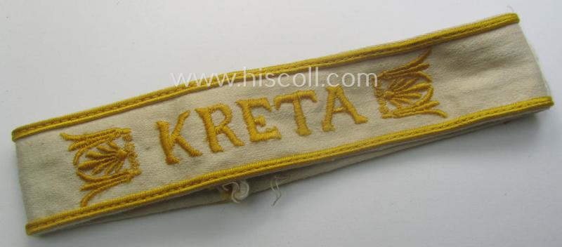 WH cuff-title (ie. 'Ärmelstreifen') entitled: 'Kreta' (being an example that bears a printed 'RbN.'-numeral and that comes in an issued-, clearly worn- and/or most certainly once tunic-attached, condition)